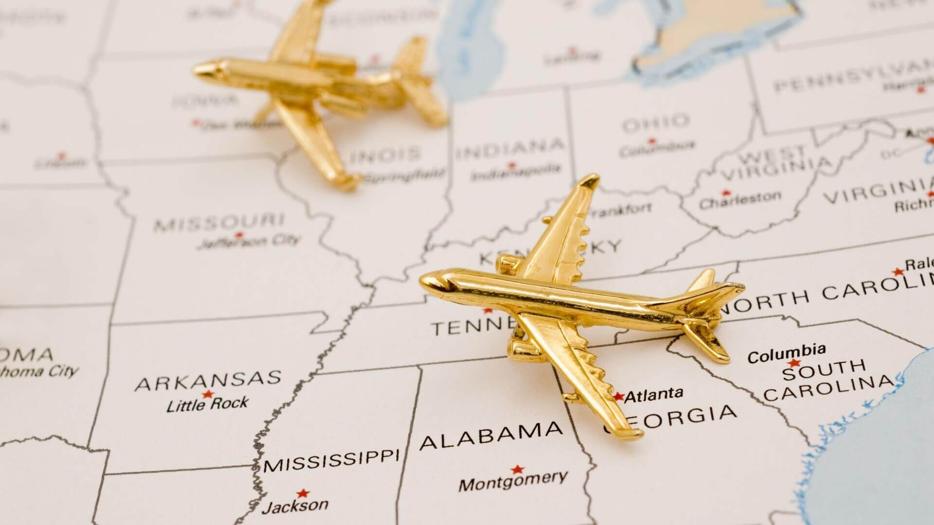 Golden airplane pin on US map for Tennessee plants