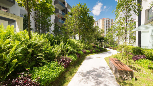 Wooden bench on stone base in lush urban oasis garden pathway